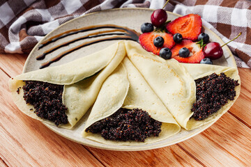 sweet dessert pancakes with quinoa on a wooden rustic background