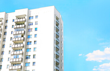 Real estate market,investments. Block house on blue sky background empty copy space. Rent a flat....