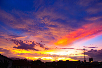 Obraz premium Colorful Sunset. Gorgeous Panorama Twilight Sky. Cloudy Rose Blue Sunset over Dark Silhouettes