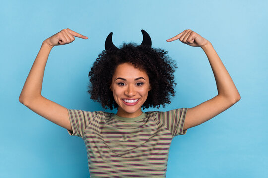 Photo of lady in horns costume creepy mystery creature point fingers hairstyle isolated blue color background