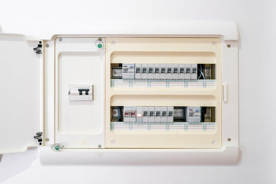 Open electricity meter with readings in building - Powered by Adobe