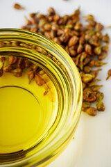 grape seed essential oil on a white background