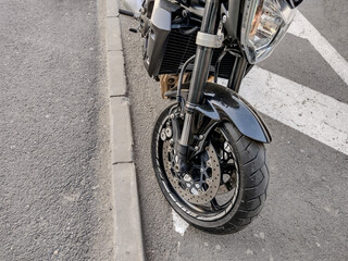 the wheel and the front of a motorcycle