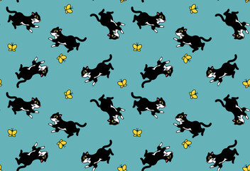 Fashionable textile seamless pattern with jumping funny black cat and butterflies on a turquoise background.