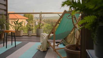 Obraz na płótnie Canvas blue chair on the balcony in the morning