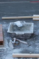 Various masonry and brickwork tools being used on a construction site