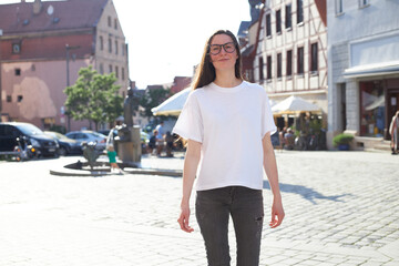 Woman wearing white t-shirt in the city