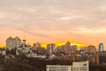 Ukraine, Kyiv – November 26, 2016: Aerial panoramic view on central part of Kyiv city, residential area at sunset. Stunning sunset, golden hour. Lukianivska area. City silhouettes. 