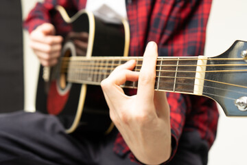 Fototapeta na wymiar person plays guitar