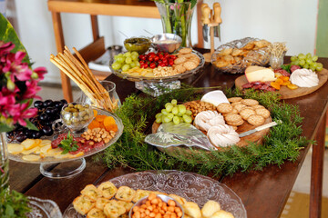 Table with snacks - party buffet with various savory foods