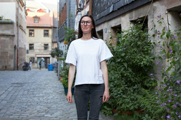 Woman wearing white t-shirt in the city