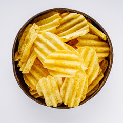 golden crispy potato chips on a white background