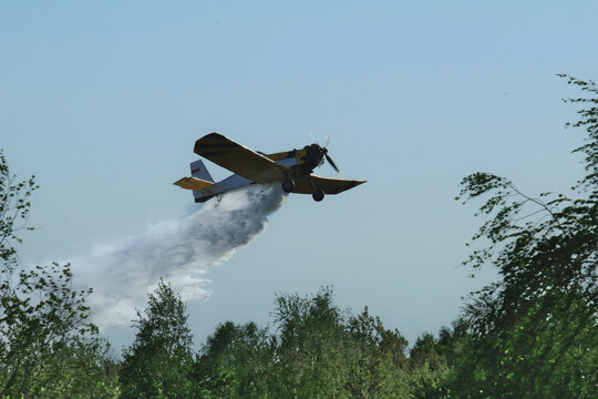 A Forest And Meadow Fire Extinguished From The Air By A Fire-fighting Plane