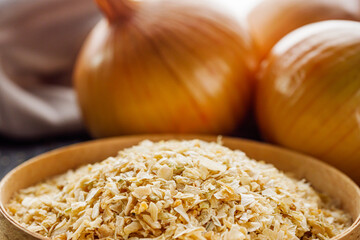 dried onions on a black wooden rustic background