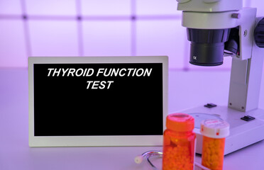 Medical tests and diagnostic procedures concept. Text on display in lab Thyroid Function Test