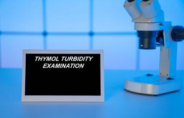 Medical tests and diagnostic procedures concept. Text on display in lab Thymol Turbidity Examination