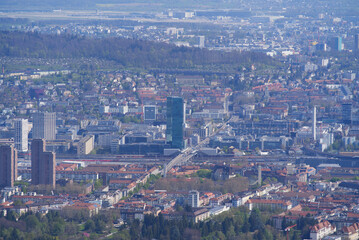 Panoramic view from local mountain Uetliberg over City of Zürich on a blue cloudy spring day. Photo taken April 14th, 2022, Zurich, Switzerland.