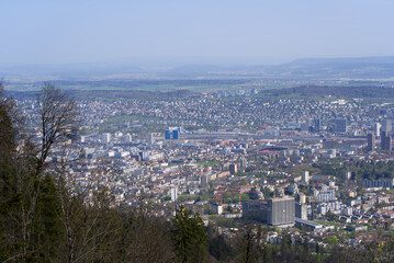 Panoramic view from local mountain Uetliberg over City of Zürich on a blue cloudy spring day. Photo taken April 14th, 2022, Zurich, Switzerland.