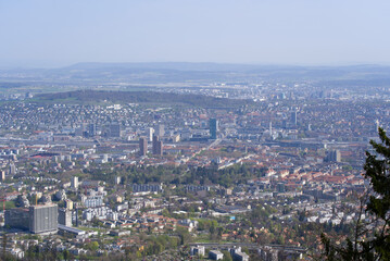Panoramic view from local mountain Uetliberg over City of Zürich on a blue cloudy spring day. Photo taken April 14th, 2022, Zurich, Switzerland.