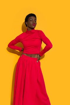 Confident Beautiful Black Woman In Red Top And Long Skirt.