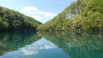 Fototapeta premium Plitvice Lakes - reflection of clouds and landscape on the lake surface - Croatia - May - 2022