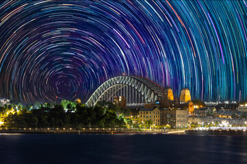 Star trails in the sky over Sydney Harbour NSW Australia startrails. lovely patterns and beautiful colours of the night.