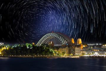 Star trails in the sky over Sydney Harbour NSW Australia startrails. lovely patterns and beautiful colours of the night.
