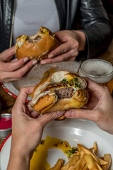 full burger and fries ready to eat