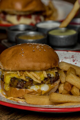 full burger and fries ready to eat