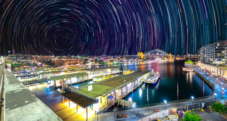 Star trails in the sky over Sydney Harbour NSW Australia startrails. lovely patterns and beautiful colours of the night.