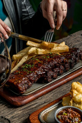pork ribs with barbecue and potatoes ready to eat