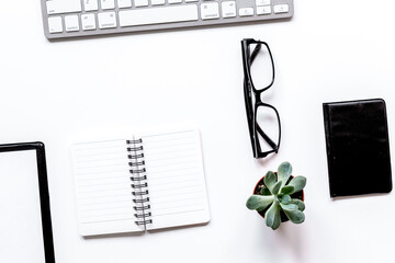 modern flat lay with office items on white desk background top view mockup