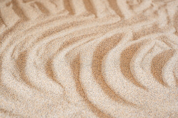 Fototapeta na wymiar Wavy sea sand background. Flat lay. Copy space
