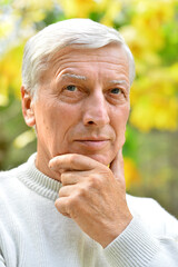 Close up portrait of a thoughtful elderly man