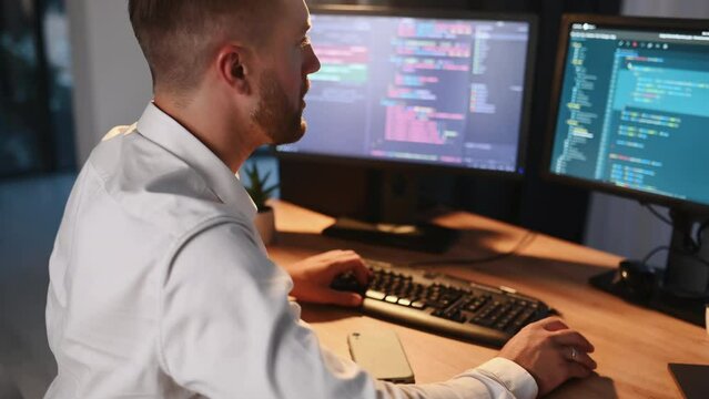 Typing on a keyboard. Software engineer working on a project by using programming language