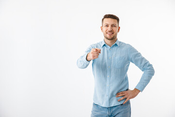 A young man in a blue shirt gestures. Motivational poster, are you ready. Copy Space.