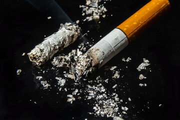 Cigarette smoking closeup isolated on balck background. No smoking concept