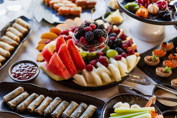 Various appetizers on the festive table. Shallow depth of field.