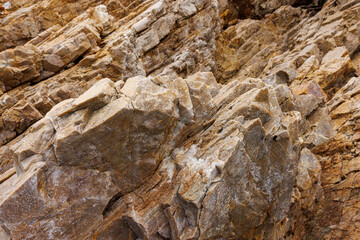 textures and patterns of natural broken rocks and erosion of sea water over time