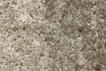 Gray dry porous stone surface close-up texture background.