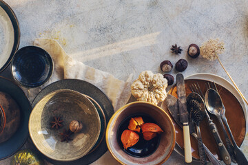Obraz na płótnie Canvas Variety of ceramic tableware, plates, bowls, glazed dishes and cutlery