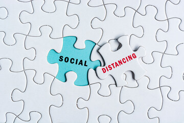 Social distancing text on Jigsaw Puzzle. Pandemic concept