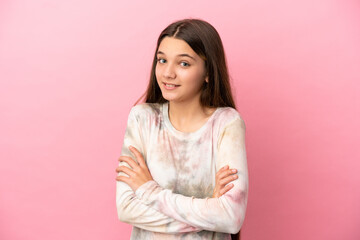 Fototapeta premium Little girl over isolated pink background making doubts gesture while lifting the shoulders