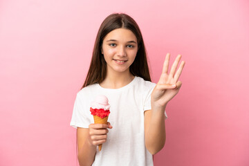 Little girl with a cornet ice cream over isolated pink background happy and counting three with...