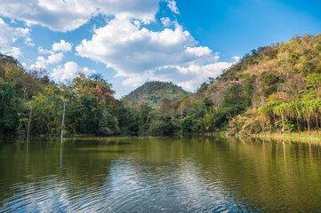Scenery of mountain with natural pond and blue sky in tropical jungle
