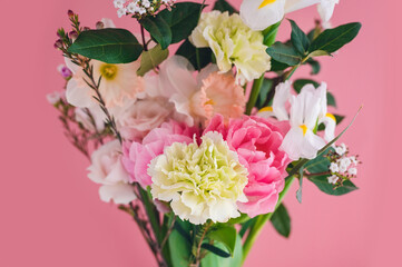 spring bouquet for the holiday on a pink background close-up