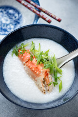 Close-up of crab congee or a type of asian rice porridge, vertical shot, selective focus
