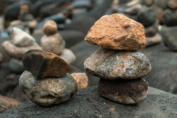Fototapeta na wymiar Pile of stones in Santinho Beach, Florianópolis