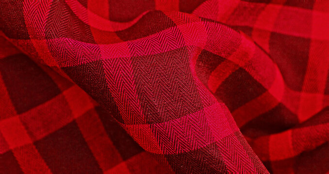 Red Clothes backdrop. Background luxury red wavy cloth. Wavy folds of grunge silk texture satin velvet clothing, luxurious background or elegant wallpaper