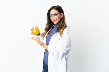 Young scientific woman isolated on white background extending hands to the side for inviting to come